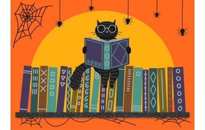 Black cat on books
